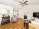 Open-concept living room featuring stylish furnishings and a fireplace at 1290 Pyrtle Dr, Graham, NC 27253