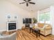 Cozy living room with fireplace, lots of natural light, and contemporary finishes at 1290 Pyrtle Dr, Graham, NC 27253