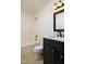 Bathroom features a vanity and a tub with shower at 1309 Jackson St, Burlington, NC 27217