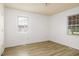 Light-filled bedroom with hardwood floors and two windows at 1309 Jackson St, Burlington, NC 27217