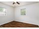 Bedroom featuring hardwood floors, light-colored walls, and a ceiling fan at 1309 Jackson St, Burlington, NC 27217