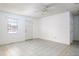 A well lit living room showing the tiled floor and entrance door at 1309 Jackson St, Burlington, NC 27217