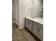 Bathroom features double sink vanity, and white cabinets at 132 Rockfall Way, Rocky Mount, NC 27803