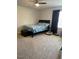 Comfortable bedroom with a bed, a window, and carpeted floors creates a cozy retreat at 132 Rockfall Way, Rocky Mount, NC 27803