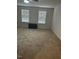 Large carpeted bedroom with two windows at 132 Rockfall Way, Rocky Mount, NC 27803