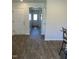 Inviting hallway with wood-look flooring and neutral wall paint at 132 Rockfall Way, Rocky Mount, NC 27803