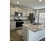 Modern kitchen featuring granite countertops, stainless steel appliances, and ample cabinet space at 132 Rockfall Way, Rocky Mount, NC 27803