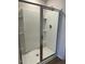 Modern shower with glass doors, built-in shelving, and sleek fixtures at 132 Rockfall Way, Rocky Mount, NC 27803
