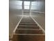 Carpeted stairs with natural light at 132 Rockfall Way, Rocky Mount, NC 27803