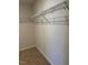 Spacious walk-in closet featuring wire shelving, and neutral walls for easy storage at 132 Rockfall Way, Rocky Mount, NC 27803