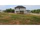 Spacious backyard featuring a wooden deck and exterior view of the two-story home at 1406 Reading Ct # 93 Kl, Burlington, NC 27217
