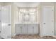 Bright bathroom features a double vanity with gray cabinets, and a large mirror above at 1406 Reading Ct # 93 Kl, Burlington, NC 27217
