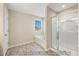 Bathroom boasts a separate shower and soaking tub, complemented by neutral-toned walls at 1406 Reading Ct # 93 Kl, Burlington, NC 27217