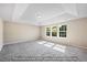 Spacious bedroom with three windows, neutral walls, and an elegant tray ceiling at 1406 Reading Ct # 93 Kl, Burlington, NC 27217