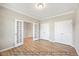 Bright bedroom featuring paneled doors and laminate floors, ready for personalization at 1406 Reading Ct # 93 Kl, Burlington, NC 27217