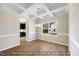 Elegant dining area with coffered ceilings, a modern light fixture, and a large window at 1406 Reading Ct # 93 Kl, Burlington, NC 27217
