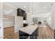 Kitchen island with granite countertops offering seamless views of living room and coffered dining area at 1406 Reading Ct # 93 Kl, Burlington, NC 27217