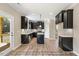 Beautiful kitchen features black cabinets, stainless steel appliances, and a center island with pendant lighting at 1406 Reading Ct # 93 Kl, Burlington, NC 27217