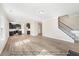 Spacious open-concept living area leading to a kitchen and a staircase, perfect for entertaining at 1406 Reading Ct # 93 Kl, Burlington, NC 27217