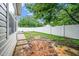 Home's backyard has mud and standing water in the yard but has a new privacy fence at 149 Cinder Cross Way, Garner, NC 27529