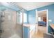 Bright bathroom showing the shower, tub, and doorway to the main bedroom at 149 Cinder Cross Way, Garner, NC 27529