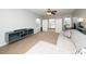 Bonus room with couch, TV console, and built-in cabinets at 149 Cinder Cross Way, Garner, NC 27529