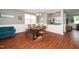 Dining room with hardwood floors, natural light, wainscoting and updated lighting fixtures at 149 Cinder Cross Way, Garner, NC 27529