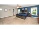 Spacious main bedroom with a ceiling fan, neutral carpet, and ensuite bathroom access at 149 Cinder Cross Way, Garner, NC 27529