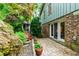 Backyard patio with colorful chairs and lush landscaping at 1513 Dellwood Dr, Raleigh, NC 27607