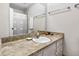 Bathroom features a patterned countertop and a large mirror above the sink at 1513 Dellwood Dr, Raleigh, NC 27607