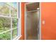 Bathroom featuring a shower with a frosted glass door and a view to outdoors at 1513 Dellwood Dr, Raleigh, NC 27607