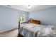 Bedroom features light blue walls and a vintage dresser, creating a cozy space at 1513 Dellwood Dr, Raleigh, NC 27607