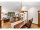 Inviting dining room connected to the living room with hardwood floors at 1513 Dellwood Dr, Raleigh, NC 27607