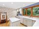 Charming kitchen with bright wallpaper, white countertops, and stainless steel appliances at 1513 Dellwood Dr, Raleigh, NC 27607