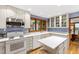 Cozy kitchen with white cabinets, white appliances, and natural light at 1513 Dellwood Dr, Raleigh, NC 27607