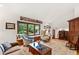 Inviting living room with large window, window seat, and comfortable seating at 1513 Dellwood Dr, Raleigh, NC 27607