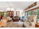 Bright living room with vaulted ceilings, natural light, and stylish furniture at 1513 Dellwood Dr, Raleigh, NC 27607