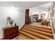 Open-concept living room view featuring hardwood floors, statement fireplace and decorative furniture at 1513 Dellwood Dr, Raleigh, NC 27607