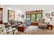 Comfortable living room featuring a window seat, hardwood floors, and stylish decor at 1513 Dellwood Dr, Raleigh, NC 27607