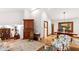 Open-concept living room with hardwood floors and a dining area at 1513 Dellwood Dr, Raleigh, NC 27607