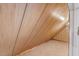 Inside look at the attic space; wood paneling and carpeted floor at 1601 Castalia Dr, Cary, NC 27513