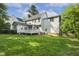 Exterior of the home with a wooden deck and a lush green backyard at 1601 Castalia Dr, Cary, NC 27513