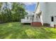 Spacious backyard with a wooden deck and well-maintained lawn at 1601 Castalia Dr, Cary, NC 27513