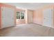 Spacious bedroom with multiple doors, plush carpeting, and a bright, airy feel at 1601 Castalia Dr, Cary, NC 27513