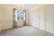 A standard bedroom with neutral colored carpet, white walls, and a double door closet at 1601 Castalia Dr, Cary, NC 27513