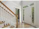 Inviting foyer with natural light, staircase, and view of the front door at 1601 Castalia Dr, Cary, NC 27513