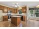 Eat-in kitchen featuring wood cabinets, island, and appliances at 1601 Castalia Dr, Cary, NC 27513