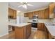 Bright eat-in kitchen featuring wood cabinets, island, and appliances at 1601 Castalia Dr, Cary, NC 27513