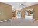 Open-concept living room showcasing a seamless transition to the adjacent kitchen and an abundance of natural light at 1601 Castalia Dr, Cary, NC 27513