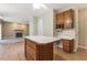 Open living room featuring wood floors, a ceiling fan and fireplace at 1601 Castalia Dr, Cary, NC 27513